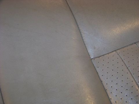 2001 Mercury Grand Marquis - Detail of perforated leather seat upholstery, likely from a car interior.