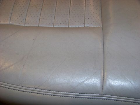 2001 Mercury Grand Marquis - Close-up of perforated leather seat upholstery, showing stitching and texture.