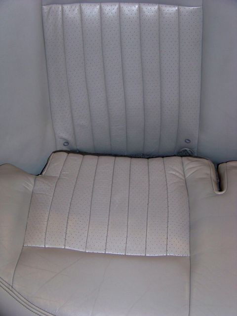 2001 Mercury Grand Marquis - Close-up view of the interior of a car, focusing on the perforated leather seats and their stitching patterns.