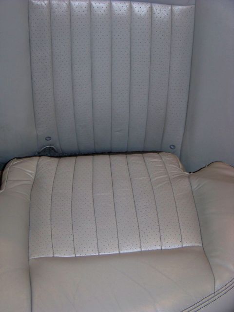 2001 Mercury Grand Marquis - Interior view of light-colored perforated leather car seats, likely from a sedan.