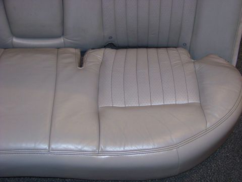 2001 Mercury Grand Marquis - Rear car seat upholstery detail, showing stitching and perforated leather sections.
