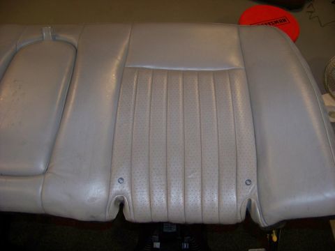 2001 Mercury Grand Marquis - Close-up of a car's rear seat, showing its upholstery and design details.