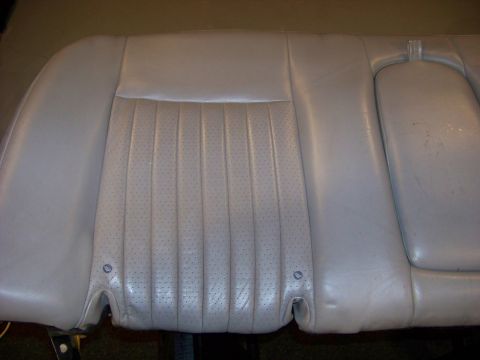 2001 Mercury Grand Marquis - A light gray car seat back with perforated leather and vertical stitching is shown.