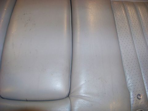 2001 Mercury Grand Marquis - Interior view of car seats, possibly from a Mercury Grand Marquis, showing wear and tear.