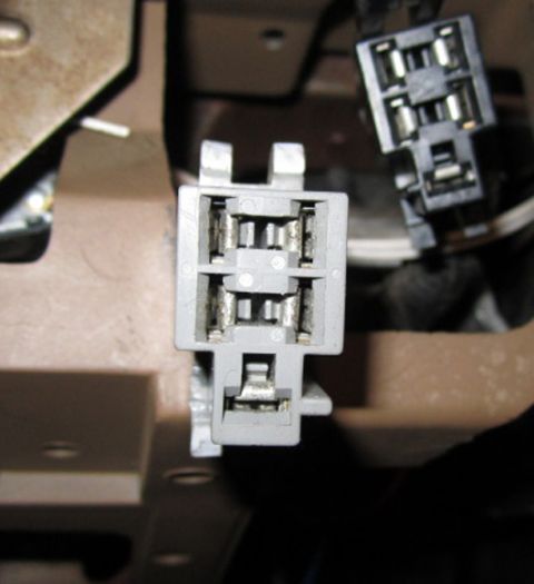 1990 Ford Bronco - This image shows a close-up view of an automotive relay socket and its associated wiring connectors.