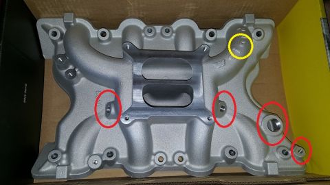 1978 Ford Bronco - Aftermarket aluminum intake manifold shown with various connection points circled for reference.