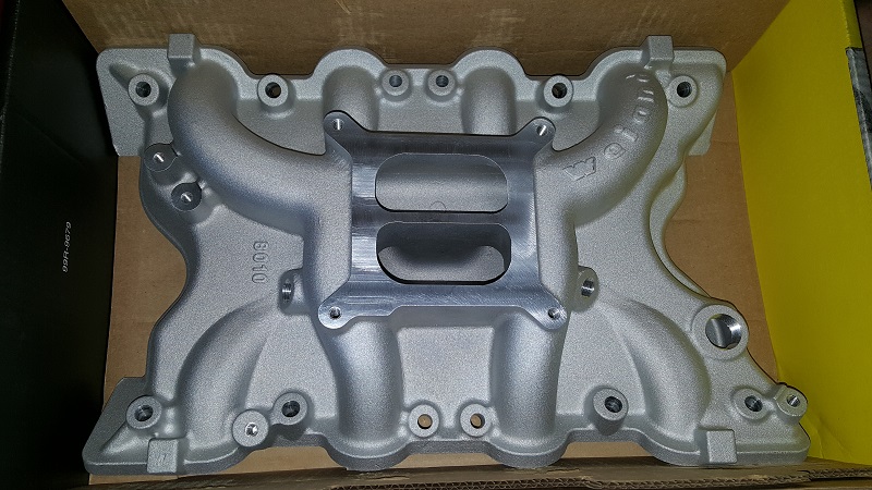 Aluminum intake manifold with dual carburetor mounting