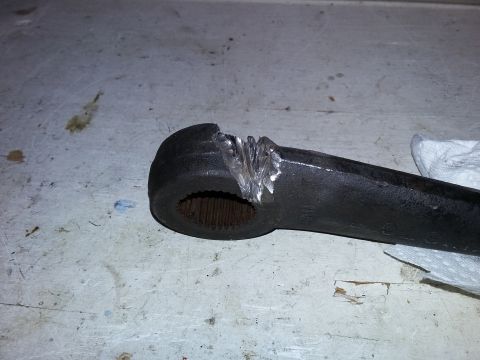 1996 Ford Bronco - Close-up of a damaged steering linkage part showing wear and repair attempts.