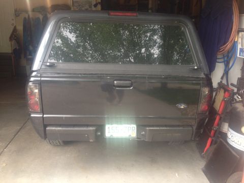2001 Ford Ranger - Rear view of a 2001 Ford Ranger pickup truck, equipped with a bed cap.