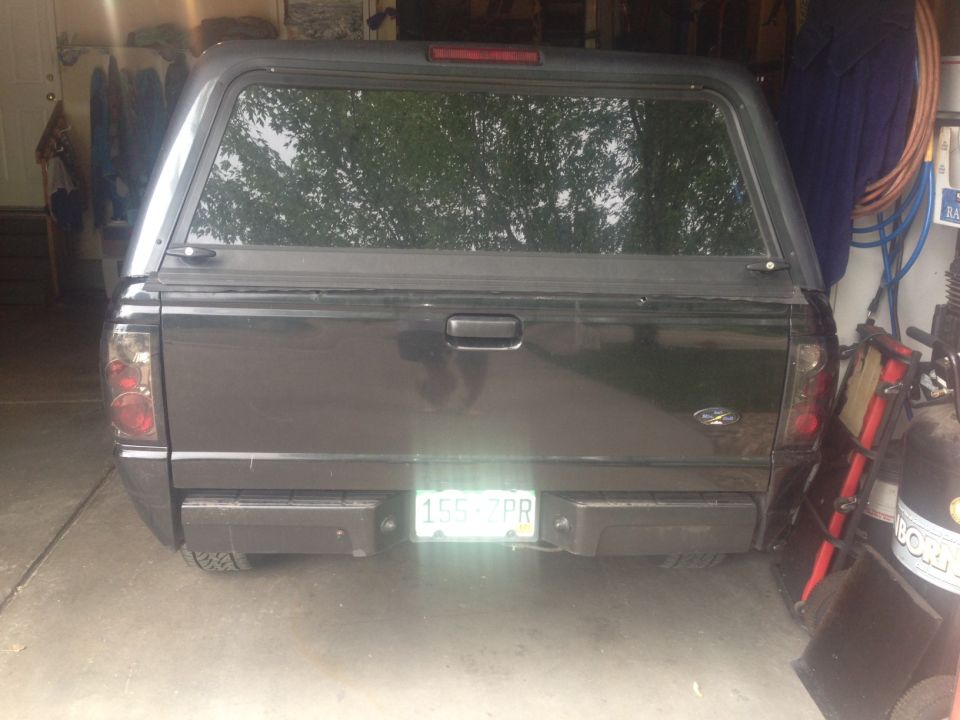2001 Ford Ranger rear view with cap, license plate 155 7PR