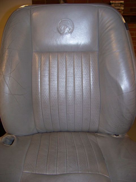 2001 Mercury Grand Marquis - Gray leather car seat with perforated center section and Mercury emblem.