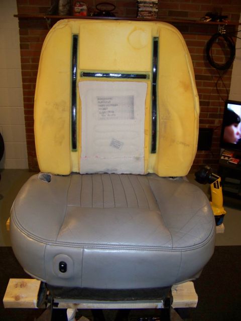 2001 Mercury Grand Marquis - A car seat, likely removed from a vehicle, is shown with its internal foam padding exposed.