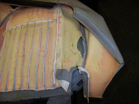 2001 Mercury Grand Marquis - Close-up view of the internal foam and stitching of a car seat, showing its construction.