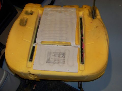 2001 Mercury Grand Marquis - The yellow foam seat cushion shows a heating element and a label with manufacturing details.