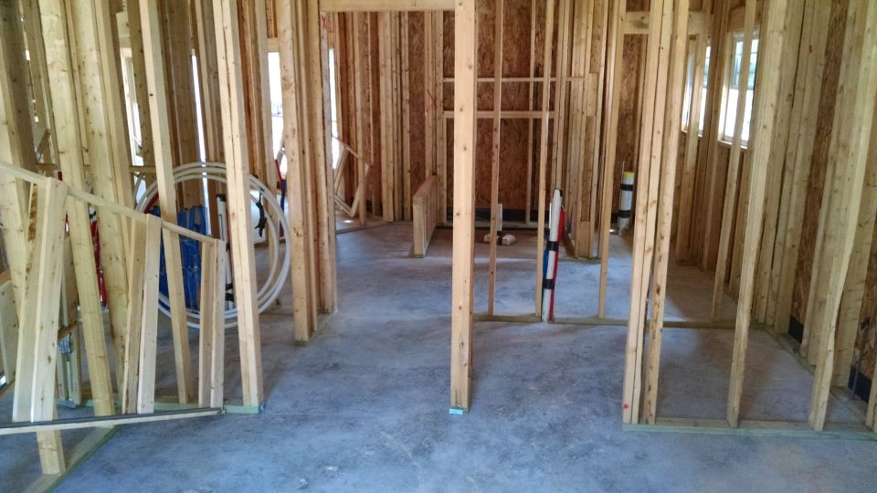 Master bedroom looking northeast through closets to master bath/shower/toilet

I spent a few hours with a new leaf blower & broom cleaning up behind the framers, and marking their mistakes.