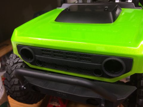 1989 Ford Bronco - This is a close-up view of the front grille and bumper of a remote-controlled car.