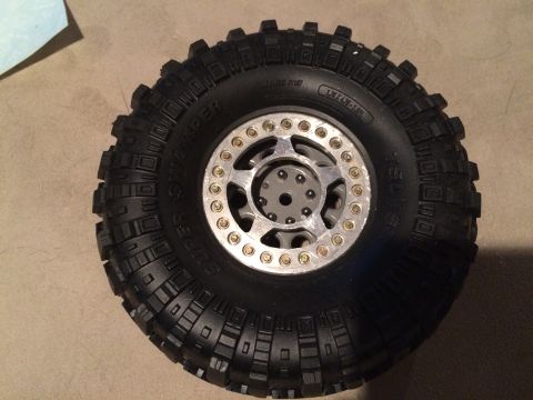 1989 Ford Bronco - This is a close-up of a tire and wheel assembly for a remote-controlled vehicle.