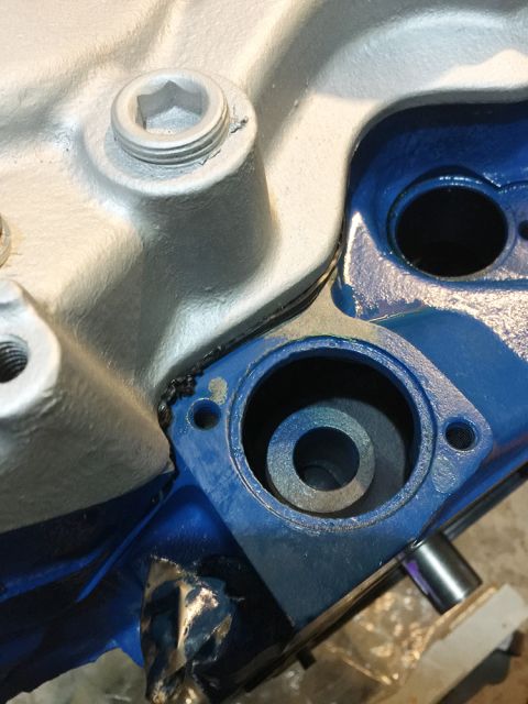 1978 Ford Bronco - This is a close-up view of an engine part, possibly an intake manifold or water pump housing.