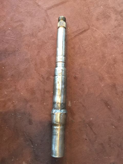 1965 Ford Mustang - Metal shaft with threaded end and welded section, likely a vehicle component.