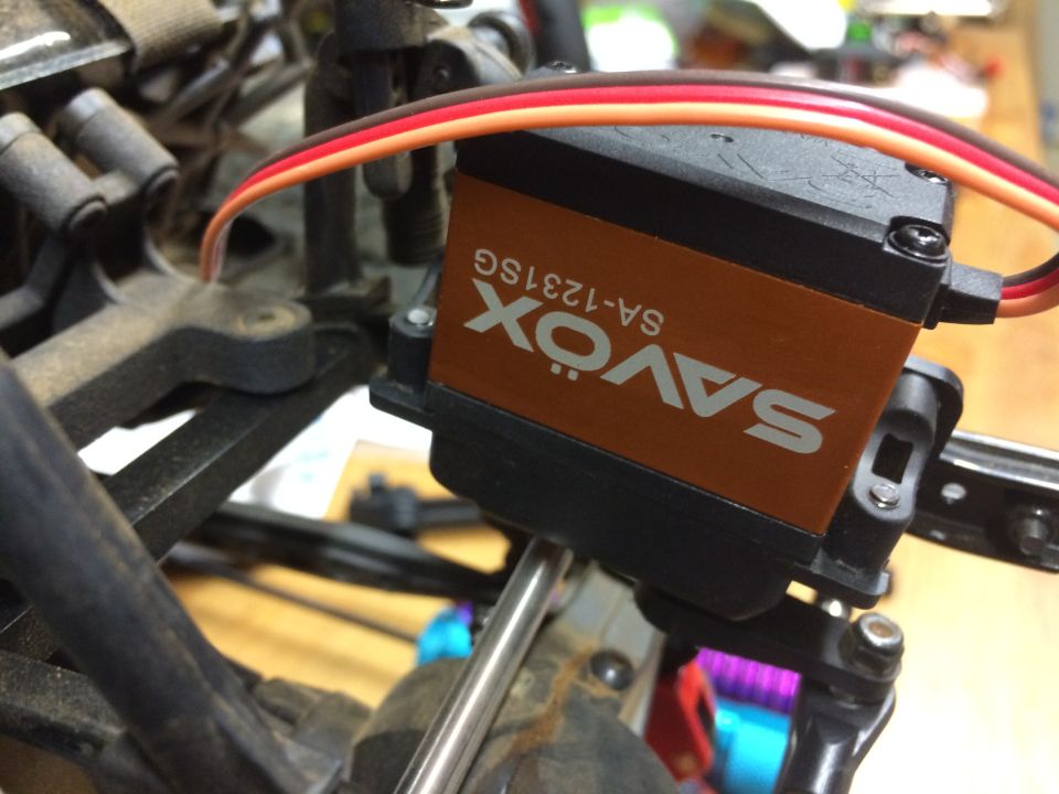 SAVOX SA-1231SG servo motor with orange casing and three wires