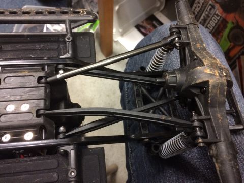 1989 Ford Bronco - Close-up view of the suspension and chassis of a remote control vehicle.