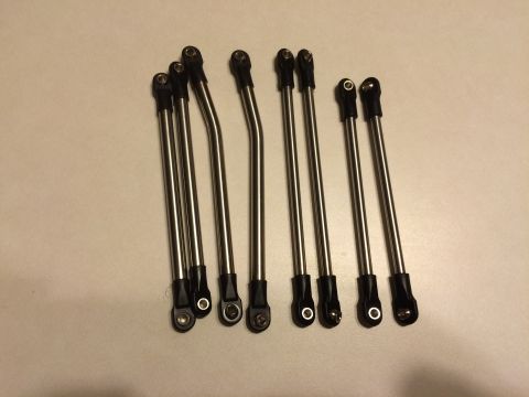 1989 Ford Bronco - A collection of metal rods, each equipped with a ball joint connector at both ends, are displayed on a neutral background.