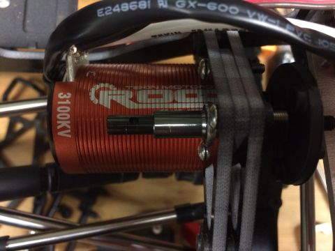 1989 Ford Bronco - Close-up of a red ROXXON MOTORS 3100KV electric motor, showing the drive shaft and surrounding components.