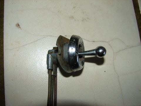1973 Ford Ranchero - Close-up of a ratchet wrench and socket tool on a flat surface.