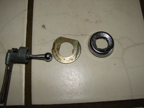 1973 Ford Ranchero - A caliper is used to measure a metal ring, with another circular object nearby.