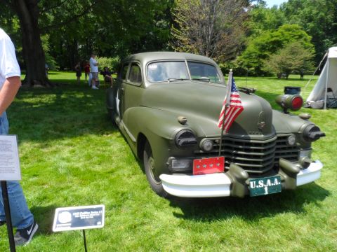 1971 Ford Ranchero - This 1942 Cadillac Series 62 sedan is presented in a military green finish, a US flag on the front grille.