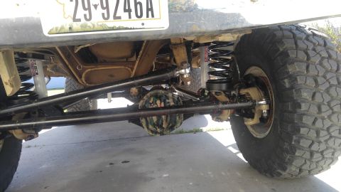 1991 Ford Bronco - Modified suspension and drivetrain components are visible on this vehicle's underside.