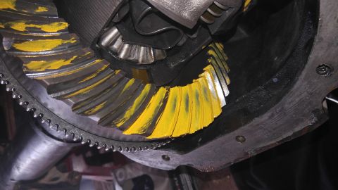 1991 Ford Bronco - Close-up of differential gears showing yellow paint applied to teeth for inspection.