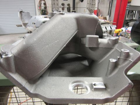 Aluminum intake manifold with a textured finish, viewed from a 3/4 front angle