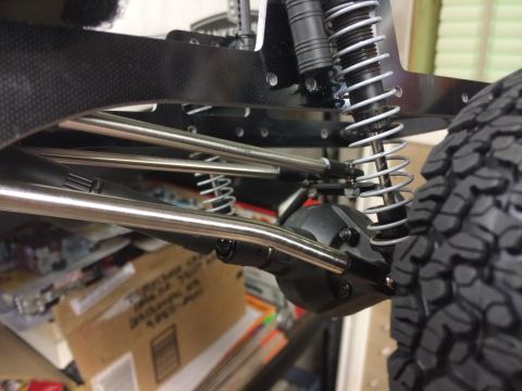 1989 Ford Bronco - Close-up view of the suspension system and tire on a radio-controlled vehicle.