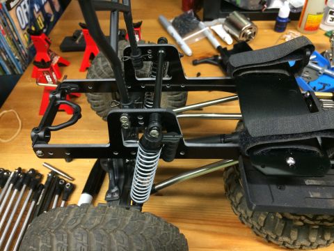 1989 Ford Bronco - Close-up view of a remote control car's chassis and suspension components.