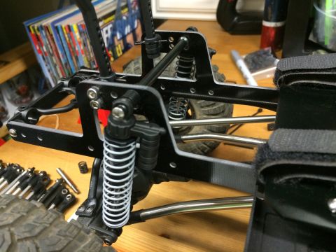 1989 Ford Bronco - Close-up view of a remote control car's suspension system, shocks and linkage components.