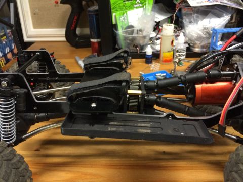 1989 Ford Bronco - Close-up view of the drivetrain and suspension assembly of a remote-controlled car.