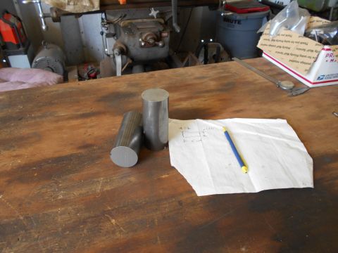 1992 Ford Bronco - Metal stock and a diagram are on a workbench next to a milling machine.