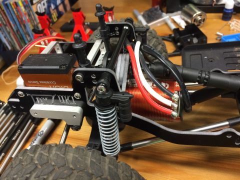 1989 Ford Bronco - The intricate internal components of a radio-controlled car chassis are displayed in this close-up shot.