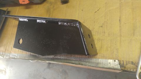 1991 Ford Bronco - A black metal bracket, likely a suspension component, is shown in detail.