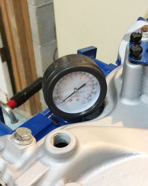 1978 Ford Bronco - A close-up of a pressure gauge on a vehicle, likely an air compressor or a related system. The gauge shows a reading between 40 and 50 PSI.