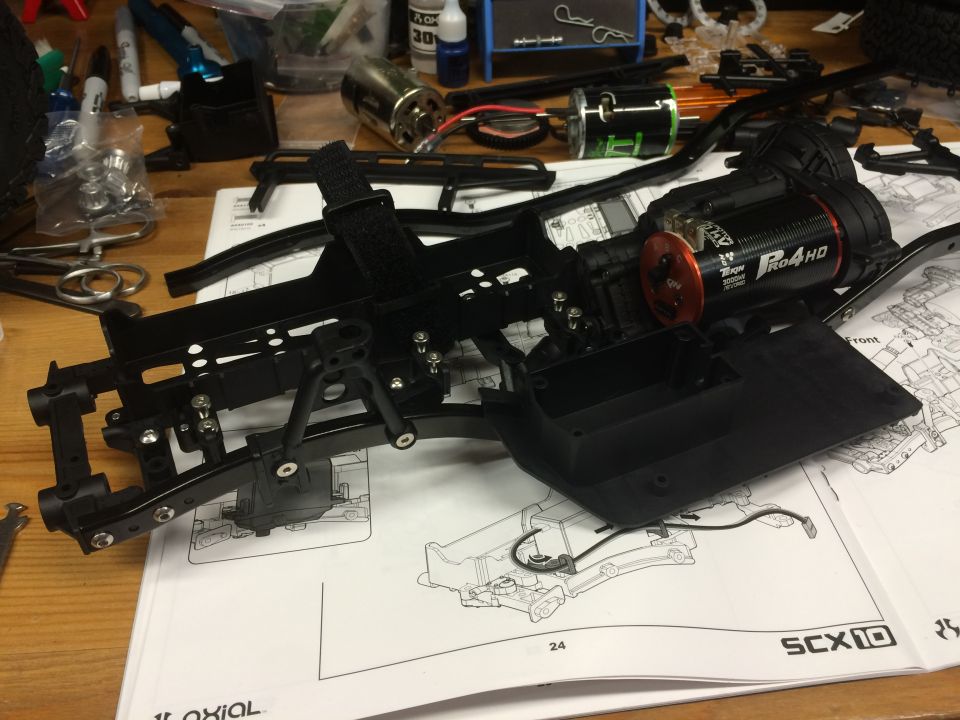 RC car chassis assembly with motor and instructions