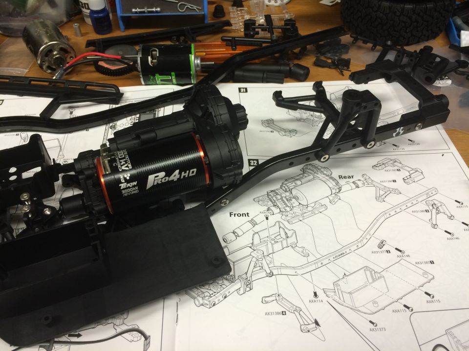 RC car chassis assembly with motor and instructions