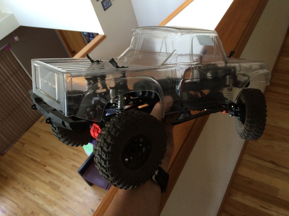 Clear plastic body of an RC truck, resembling a classic pickup
