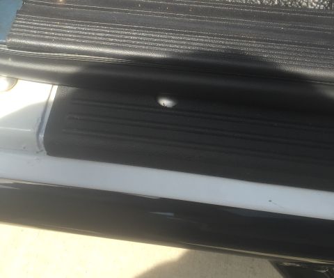 1995 Ford Bronco - Close-up view of the interior door sill and textured step plate.