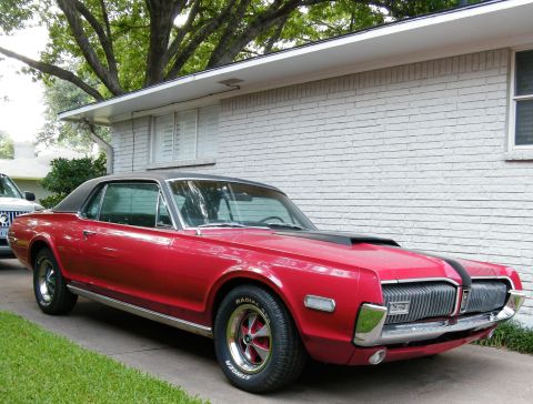 1968 Mercury Cougar - A classic 1968 Mercury Cougar is shown parked in a driveway next to a house.