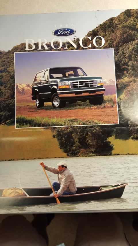 1996 Ford Bronco - This brochure features a 1995 Ford Bronco and a man in a canoe on a lake.