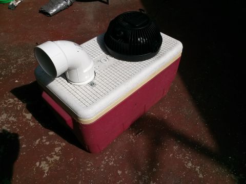 1996 Ford Bronco - A homemade air conditioner unit constructed from a cooler, a PVC pipe and a black fan.