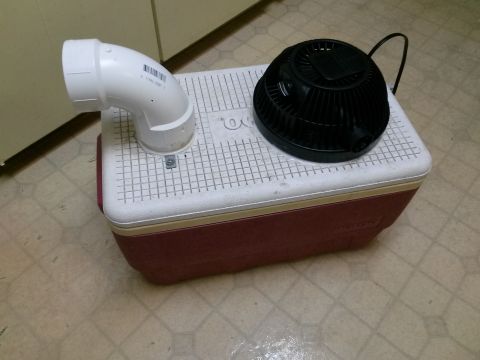 1996 Ford Bronco - A homemade air conditioner unit constructed from a cooler, fan, and PVC pipe is shown.