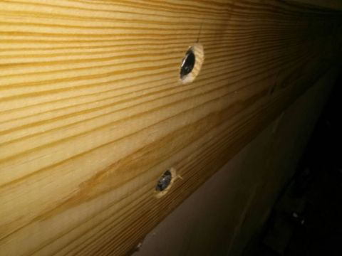 1996 Ford Bronco - Close-up of wooden beams with visible bolts, a Supermotors watermark at the bottom right.